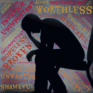 A silhouette of a person sitting with their head in their hands with the words "worthless," "broken," "unimportant," and more in the background.