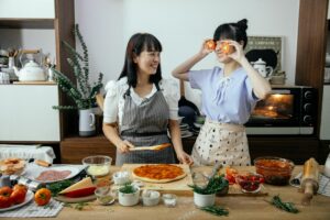 Two women cooking together.