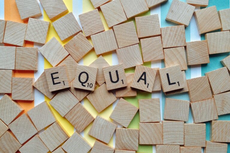 Scrabble tiles spelling out the word "Equal."