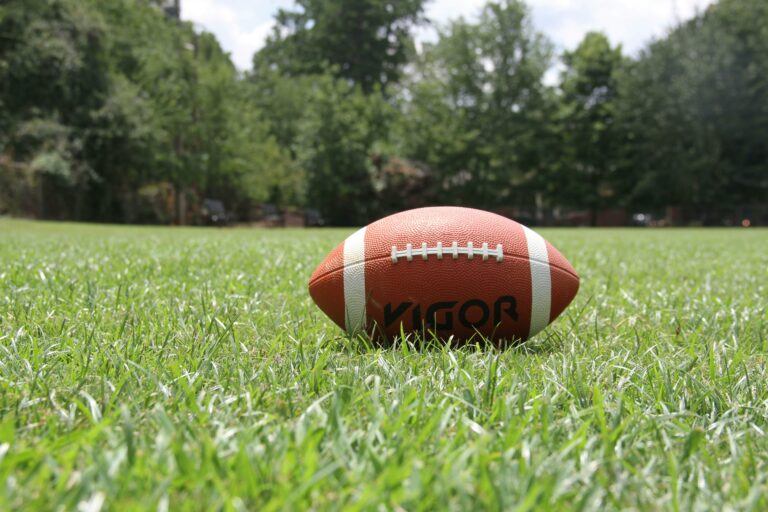 A football on a field of grass.