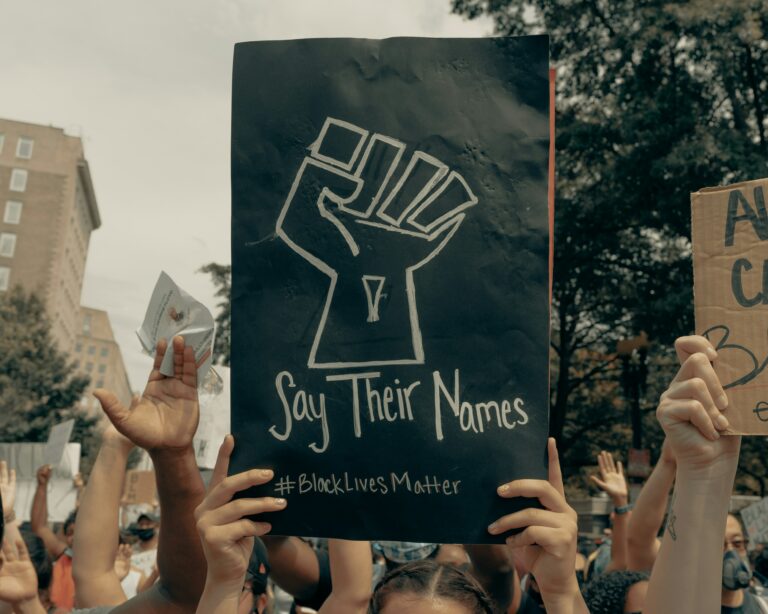 A protest sign that says "Say their names, #blacklivesmatter."