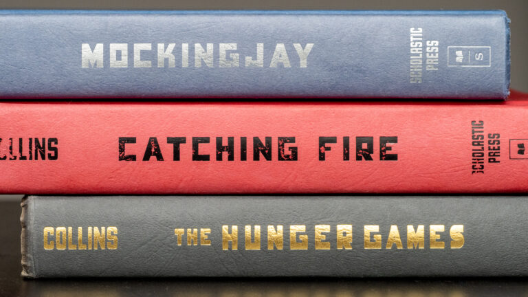 The spines of the "Hunger Games," "Catching Fire," and "Mockingjay" books.
