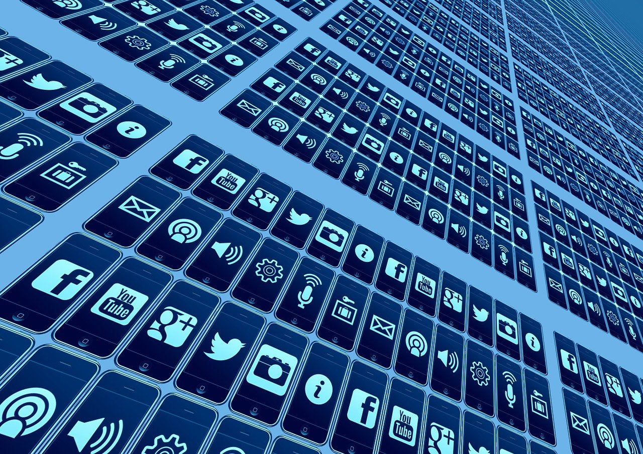 A bunch of phone screens showing different social media logos.